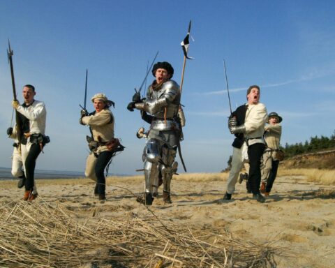 Photo of Men Holding Weapons