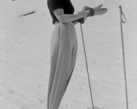 greyscale photography of woman using snowboard